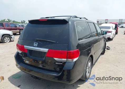2010 Honda Odyssey Touring z USA, uszkodzony, nr VIN 5FNRL3H90AB070720